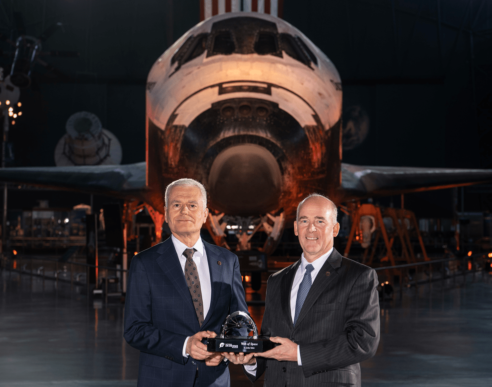 Mark Clampin, Astrophysics Division director at NASA Headquarters, accepts the 2023 Michael Collins Trophy for Lifetime and Current Achievements from Christopher Browne, John and Adrienne Mars Director of the Smithsonian's National Air and Space Museum