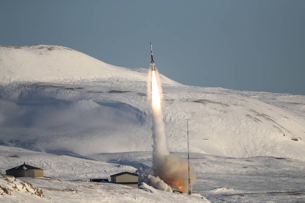 rocket launches against snowy backdrop