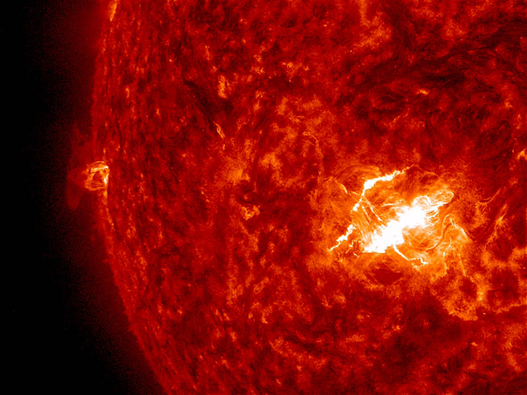 A strong flare (X-class, the largest class) erupted into space from an active region that was roughly facing towards Earth.