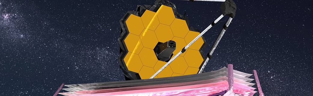 Artist conception of the James Webb Space Telescope deployed in space viewed from below and angled up and to the right. The telescope has large gold hexagonal mirrors. The multi-layer sun shield is pink below the mirrors.