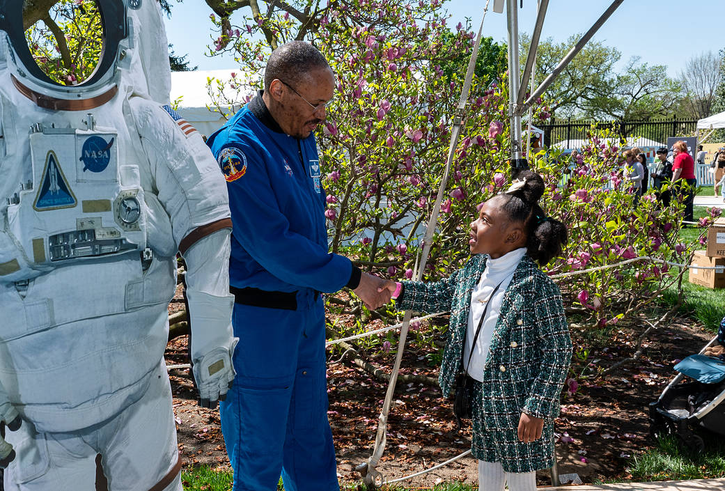 NASA astronaut Alvin Drew shakes hands with a guest during the White House Easter Egg Roll, Monday, April 10, 2023, on the South Lawn of the White House in Washington.