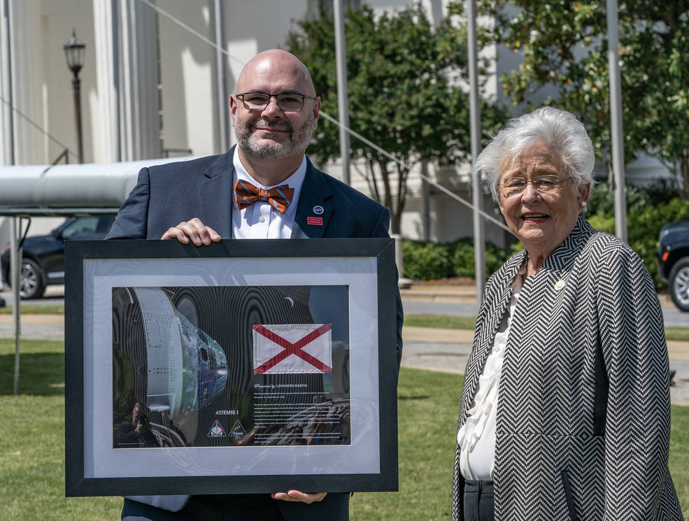 NASA’s Marshall Space Flight Center Deputy Director Joseph Pelfrey presents Gov. Kay Ivey with a flag flown on the Orion spacecraft. 
