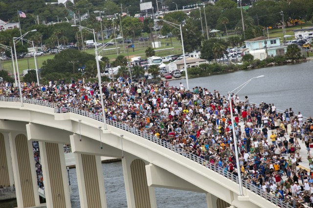 Crowd on bridge in Titusville Florida awaiting shuttle launch