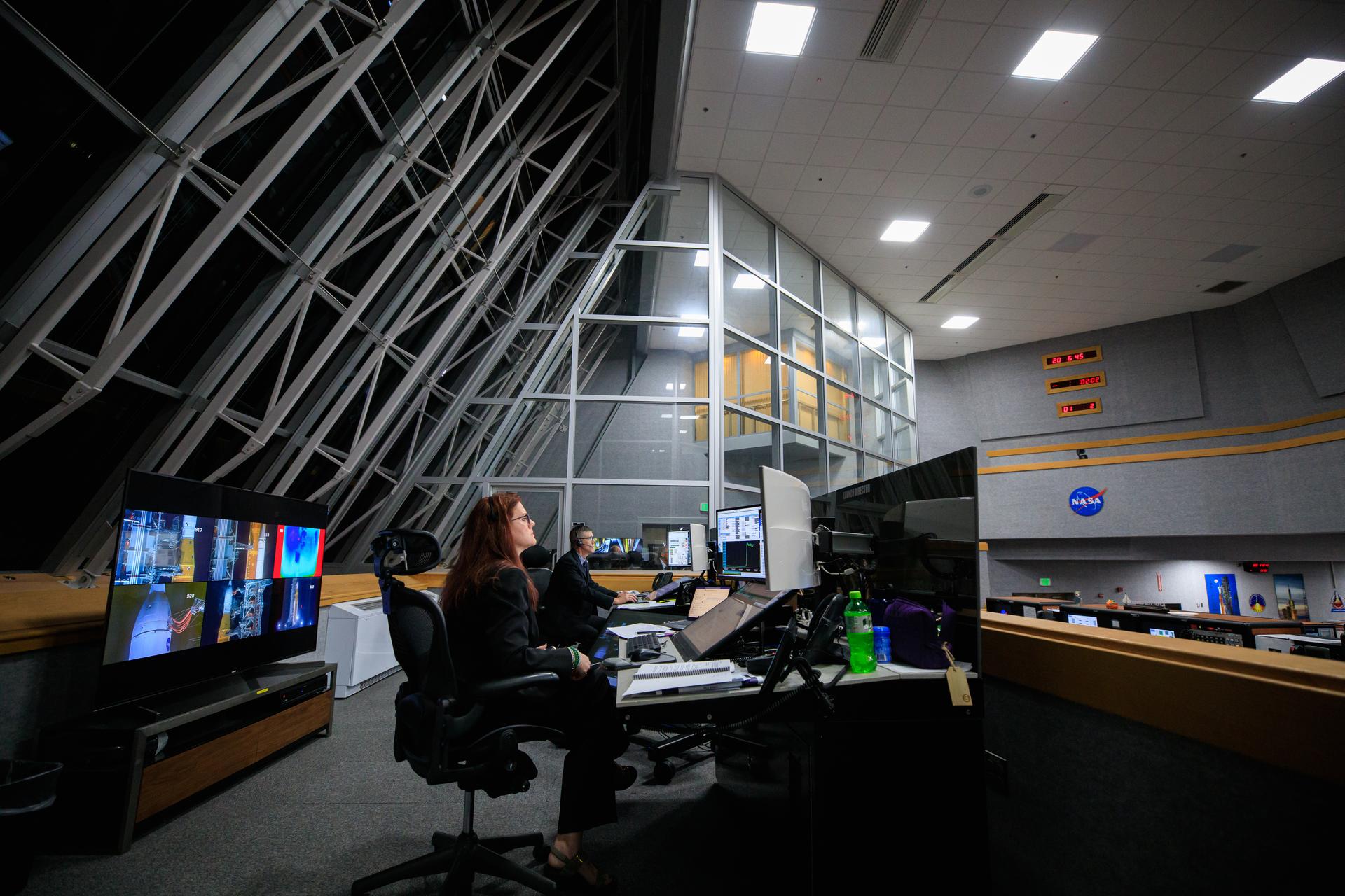 The Artemis I launch director sits at her console inside the Launch Control Center.
