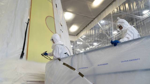 Technicians at NASA’s Marshall Space Flight Center in Huntsville, Alabama, apply the first round of spray foam as part of the thermal protection system to the launch vehicle stage adapter (LVSA) of NASA’s SLS (Space Launch System) rocket for Artemis III.