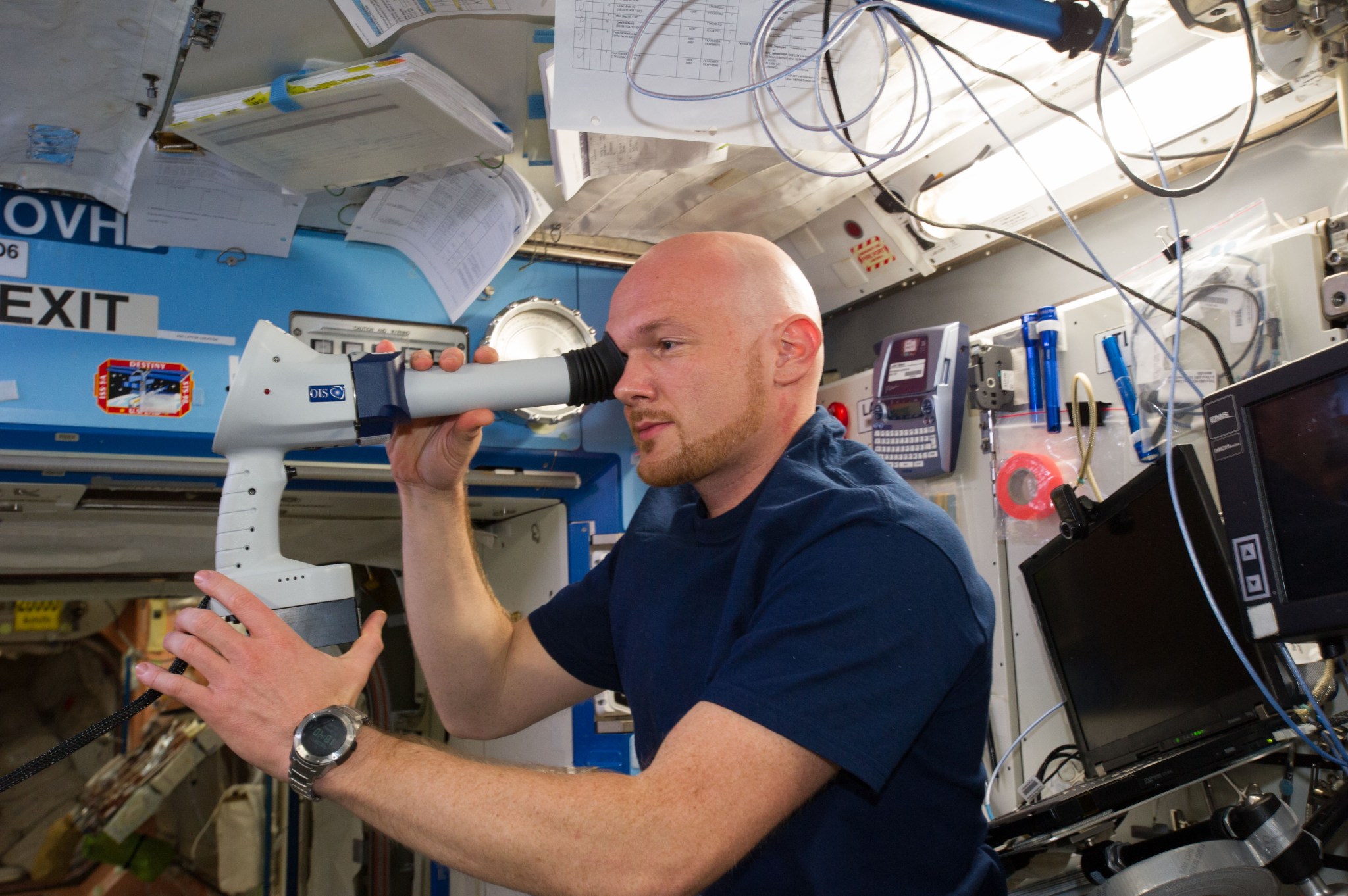 ESA astronaut Alexander Gerst conducts an exam for a previous investigation on eye health. A current study, ISAFE, also measures eye changes in space.