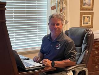 Robert Vaughan, a senior systems engineer in the SLS Boosters Element Office, works from his home office.