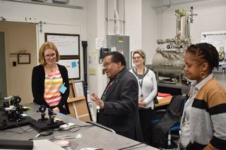 Harry Shaw, a quantum communications and computing activities lead for NASA’s Goddard Space Flight Center, gives Barbara Adde, the Policy and Strategic Communications Director for SCaN, and visitors a tour of the quantum laboratory. 