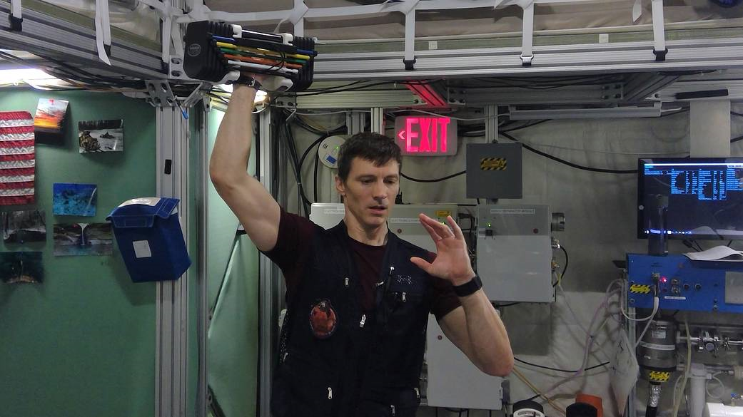 HERA crew member exercises with power block.
