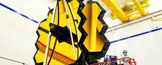 Technicians work on the James Webb Space Telescope.