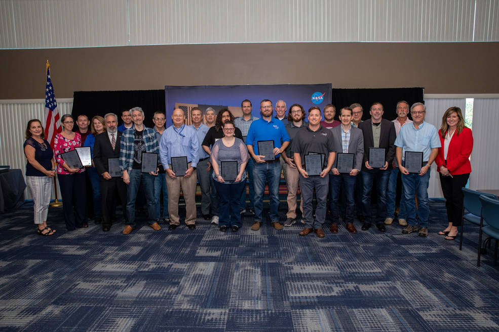 Patent recipients gather for a group photo during the 2023 Innovator Recognition event at NASA's Kennedy Space Center in Florida on March 9, 2023.