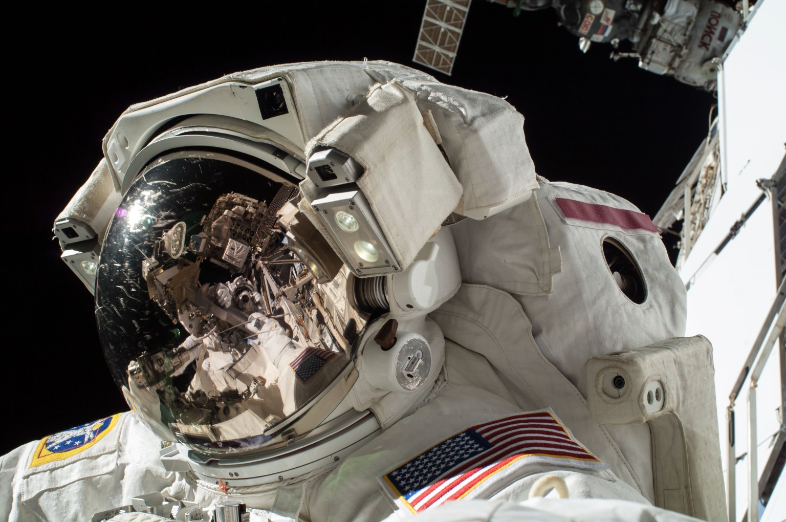 View of Reid Wiseman, Expedition 41 Flight Engineer (FE), in his Extravehicular Mobility Unit (EMU), during Extravehicular Activity 28 (EVA 28)