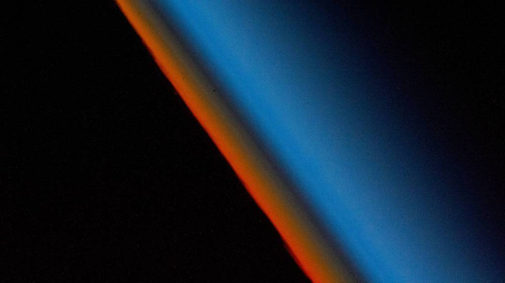 Atlantic Sunset, The last rays of an orbital sunset fade into the Earth's atmosphere in this photograph from the International Space Station.