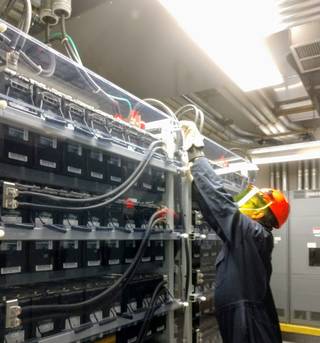 Curtis Tucker working on battery systems