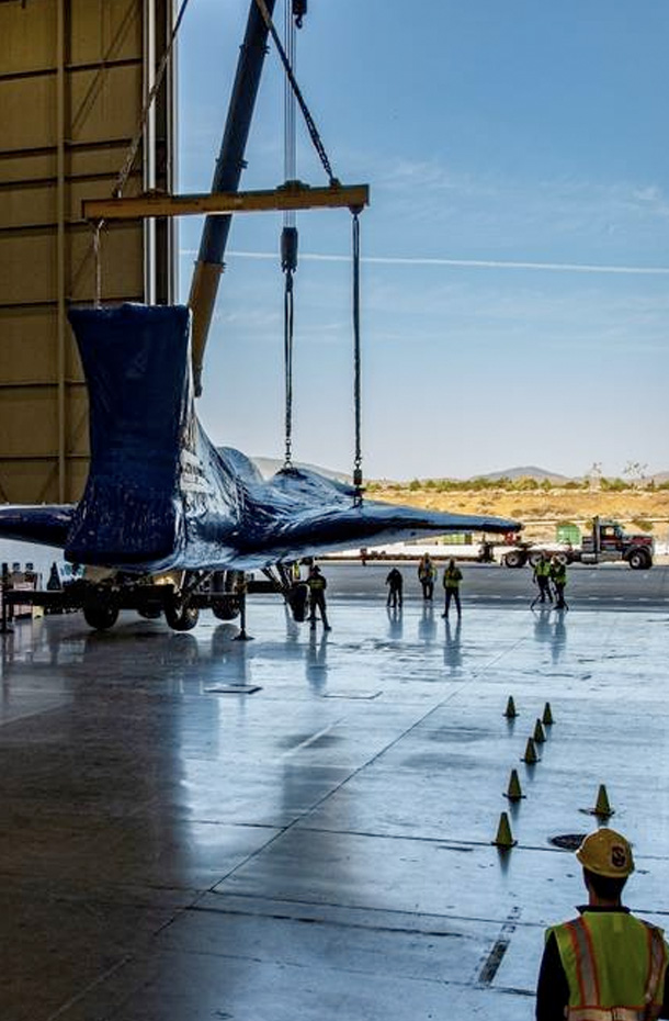 The X-59 getting prepared to be moved out of the hangar.