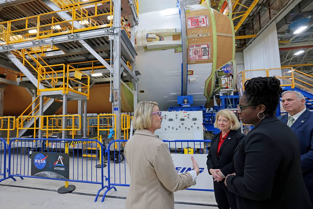 Pam Melroy, middle, and Dr. Quincy K. Brown, front right, are shown the core stage of NASA’s Space Launch System (SLS) rocket by Jennifer Boland-Masterson, left, during a March 31 visit to Michoud in New Orleans. 