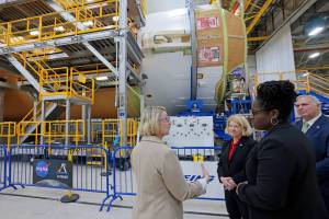 Pam Melroy, middle, and Dr. Quincy K. Brown, front right, are shown the core stage of NASA’s Space Launch System (SLS) rocket by Jennifer Boland-Masterson, left, during a March 31 visit to Michoud in New Orleans.