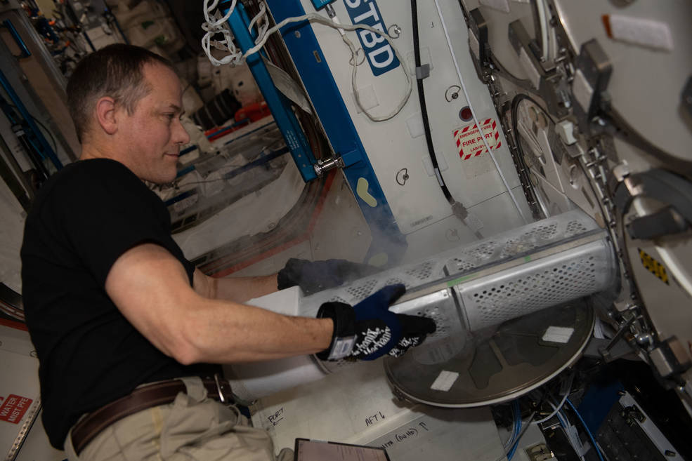 NASA astronaut Thomas Marshburn stores blood samples collected for scientific investigations in the station’s Minus Eighty-Degree Laboratory Freezer (MELFI). 
