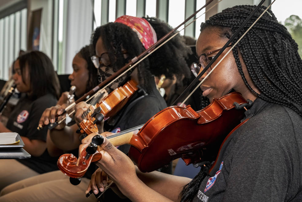 Students with the ASCTE band perform during the signing event with Marshall. 