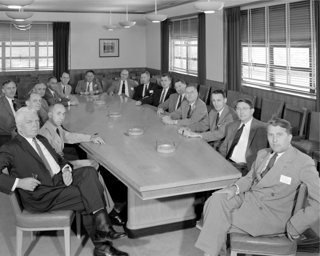 NACA's Special Committee on Space Technology at a meeting at the NACA Lewis Flight Propulsion Laboratory in Ohio, May 26, 1958. The members are seated around a conference table facing the camera.