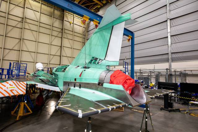 Back-side view of the X-59 tail with a red cover over the engine nozzle. The red plug or covering protects the engine by creating a barrier so that foreign objects cannot enter the engine or engine inlet.