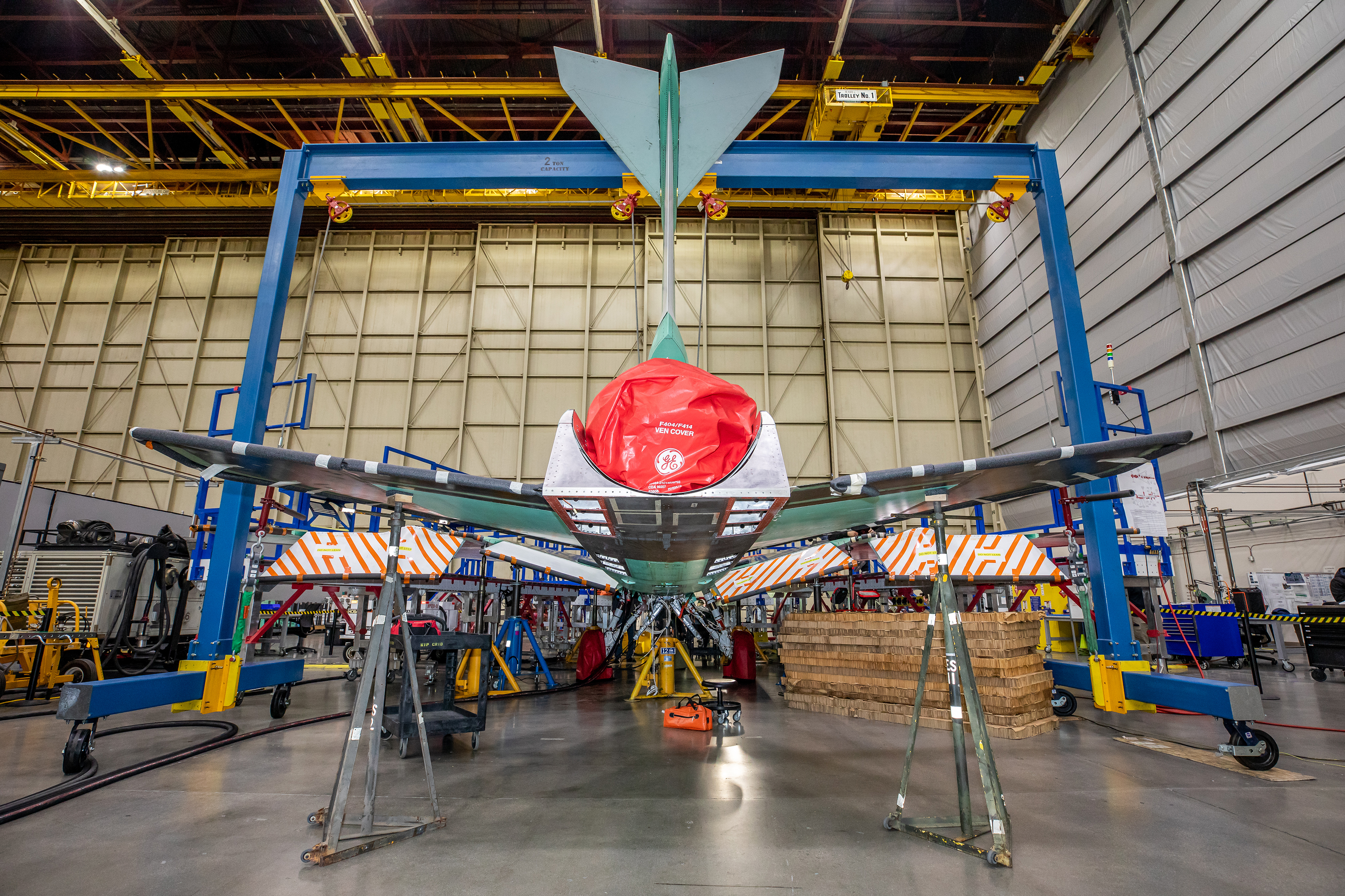 Back view of the X-59 tail with a red cover over the engine nozzle.