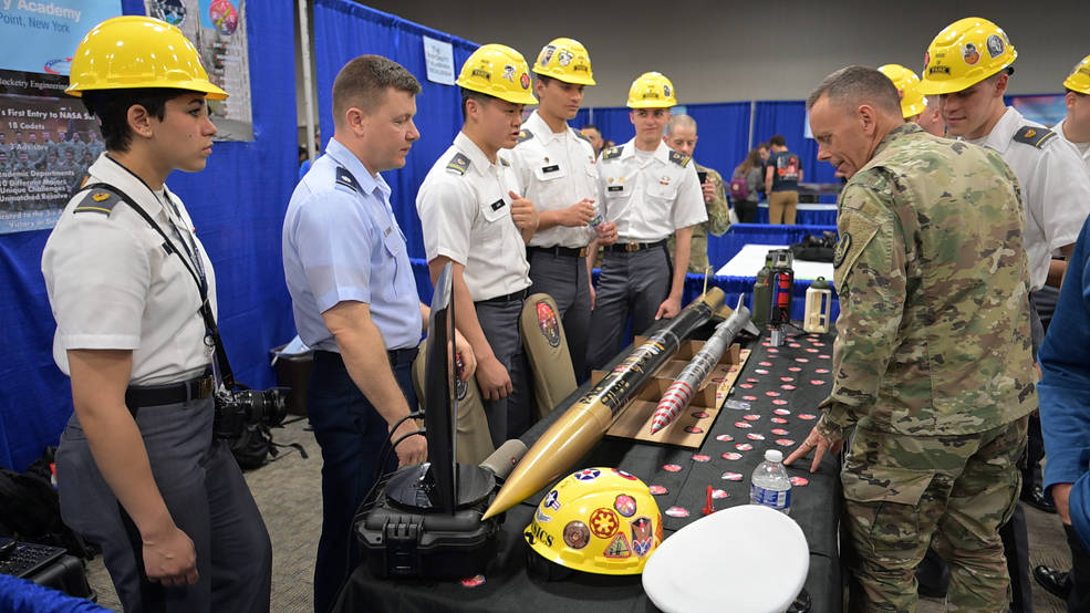 Team members from the U.S. Military Academy at West Point, New York, display their rocket during the Rocket Fair in Huntsville on April 14. 
