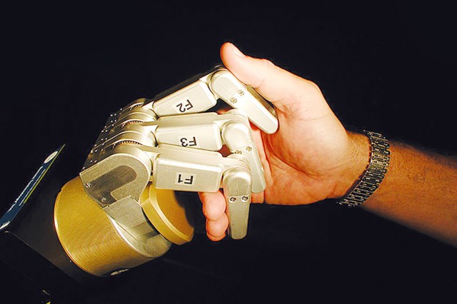 handshake - robot hand and human hand