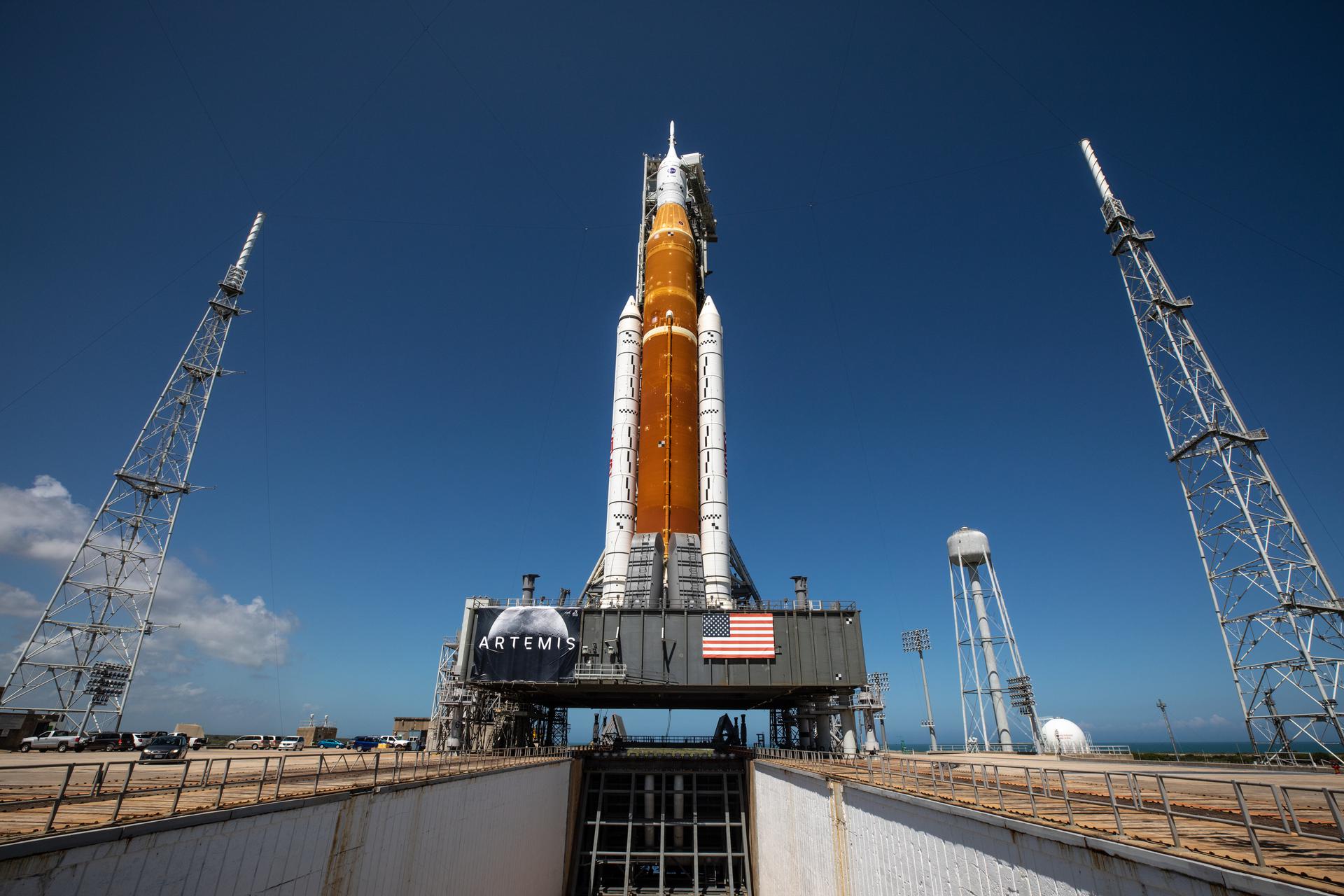 In this view looking up from the flame trench at Launch Pad 39B NASA's Space Launch System rocket and Orion spacecraft are seen atop the mobile launcher.