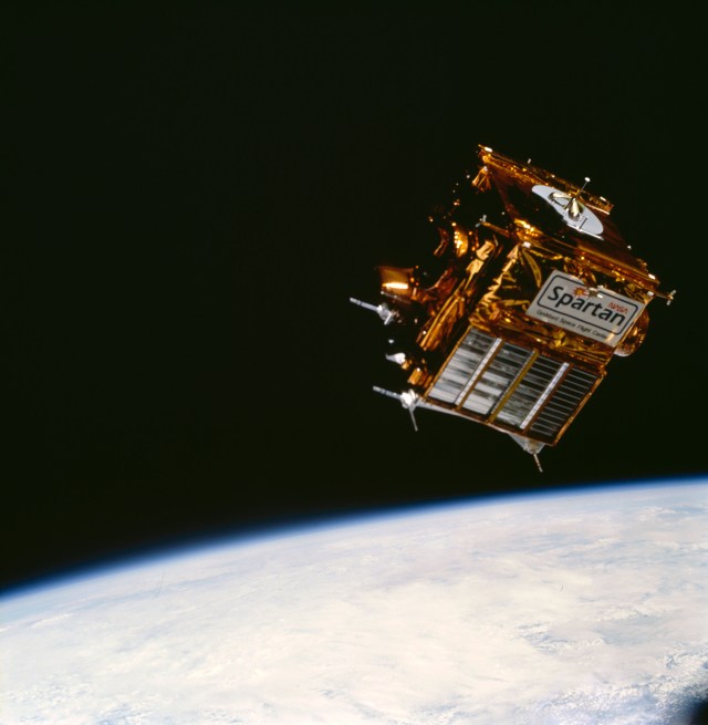 Free-flying SPARTAN 204 satellite seen above the Earth against the blackness of space.