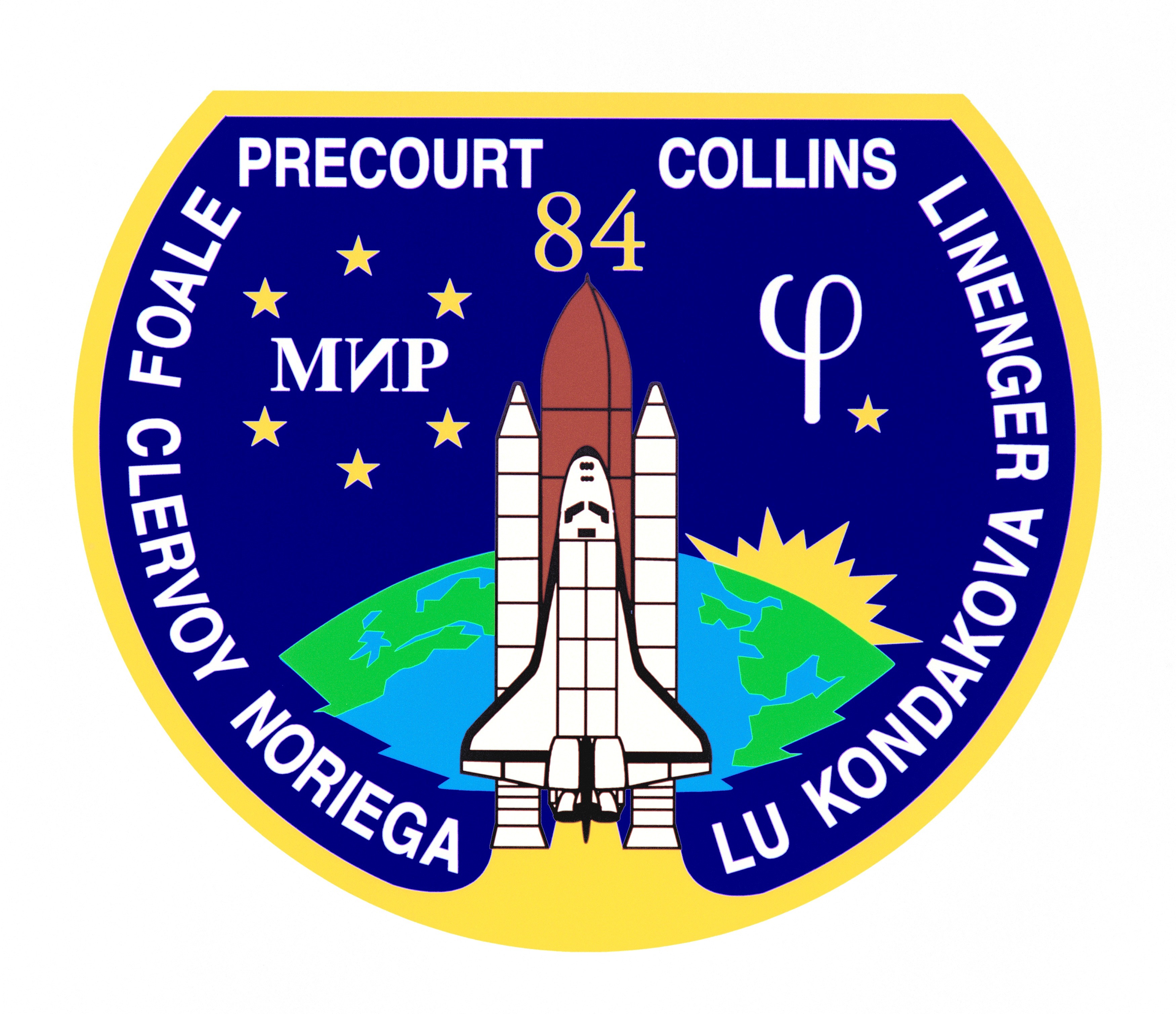STS-84 mission patch with an image of the Space Shuttle Atlantis launching in the middle with the Earth behind. The names of the astronauts are around the edge of the patch