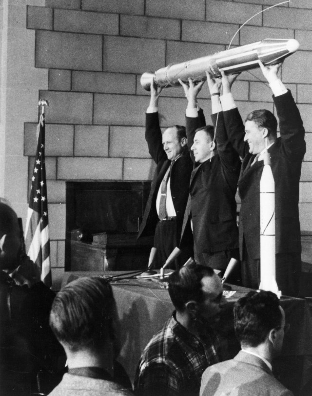 William Pickering, the director of NASA's Jet Propulsion Laboratory, scientist James Van Allen and rocket pioneer Wernher von Braun hold up a model of the Explorer 1 spacecraft during a press conference for the satellite's successful launch into space.