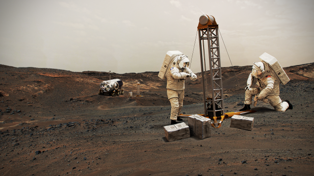 Three astronauts are on the surface of a unnamed planet.