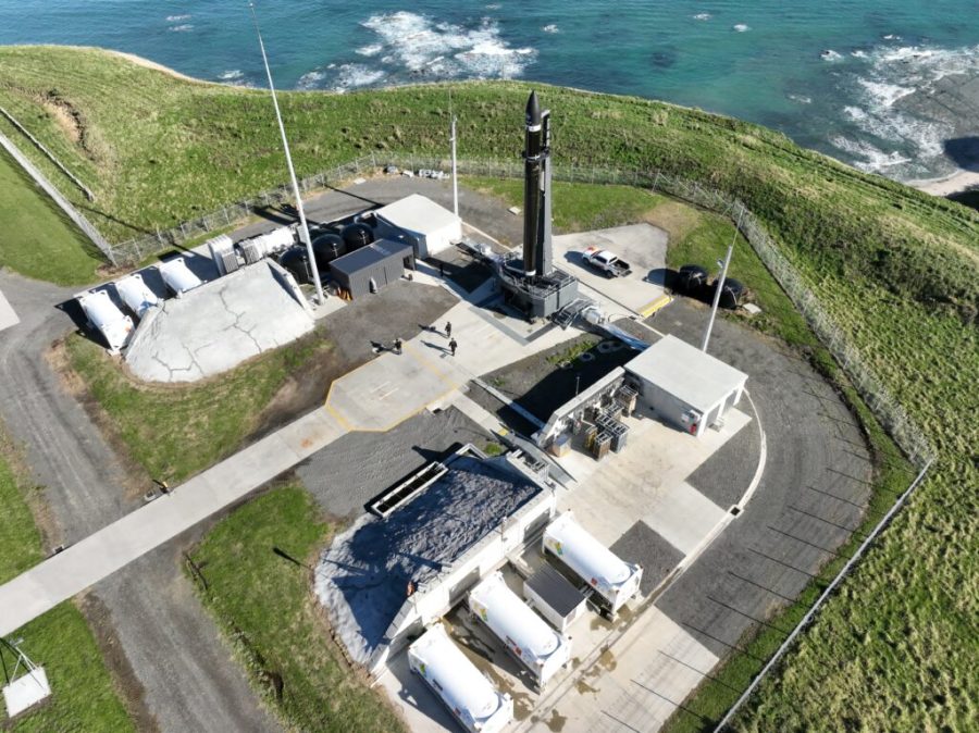 Extreme wide shot view of Rocket Lab's Launch Complex 1 in Mahia, New Zealand. The Electron rocket stands vertical at the launch pad.