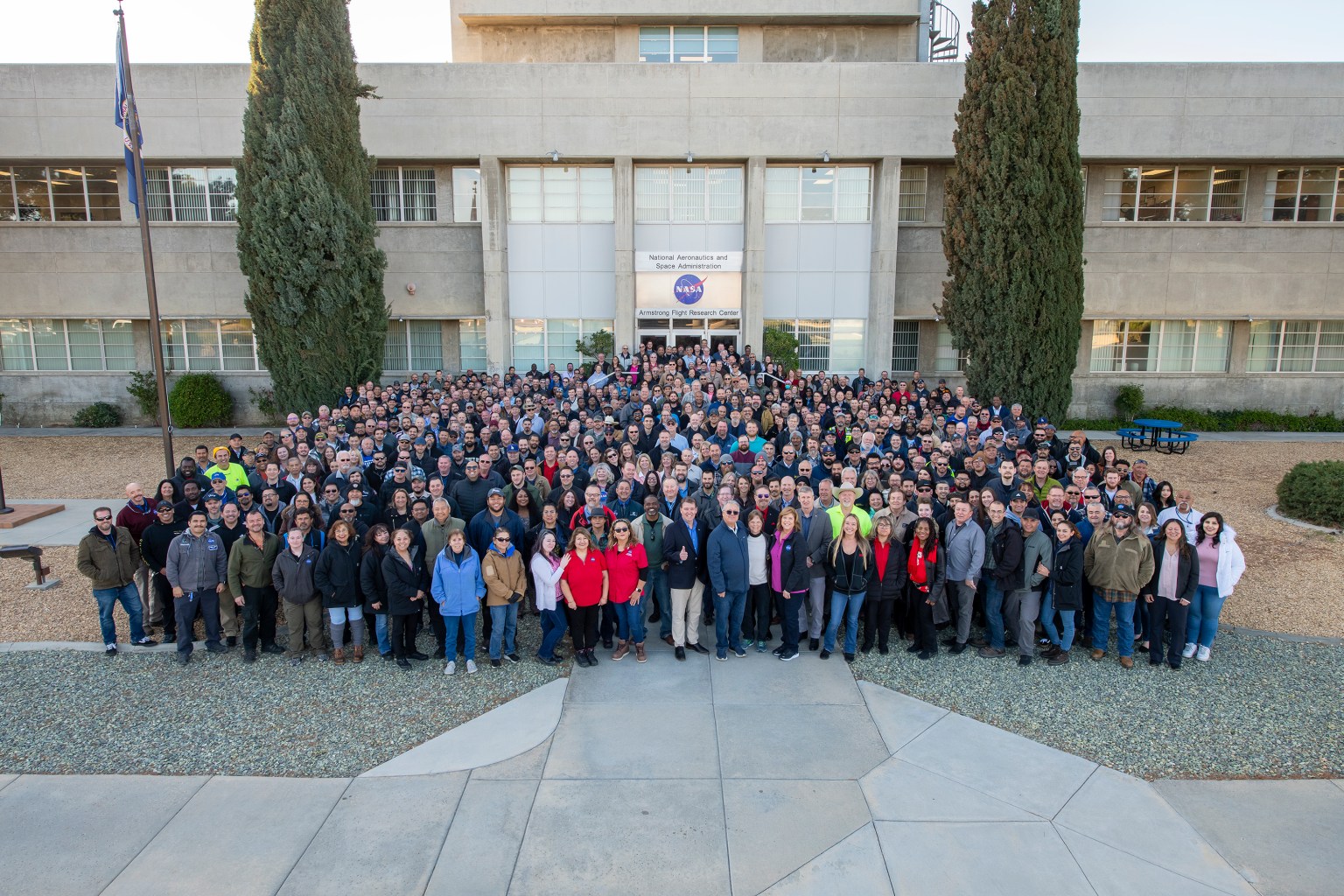 Large group of people in front of a building.