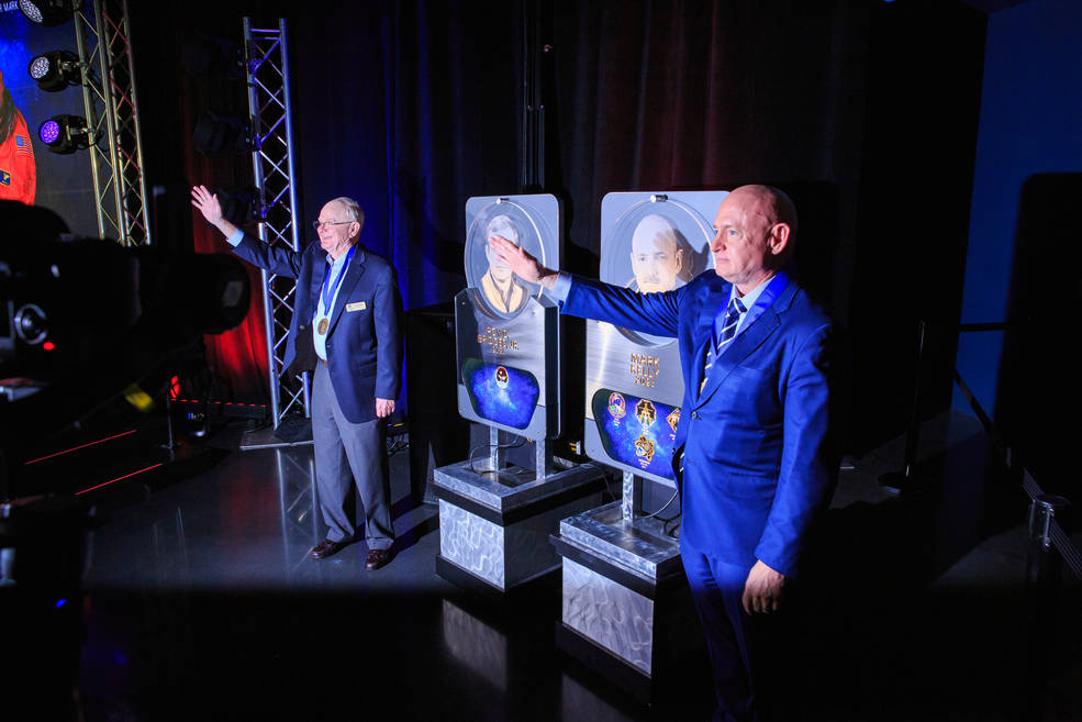 Inside the Space Shuttle Atlantis attraction at NASA’s Kennedy Space Center Visitor Complex in Florida, from left, Roy D. Bridges Jr. and Mark Kelly, are inducted into the U.S. Astronaut Hall of Fame Class of 2023 on May 6.