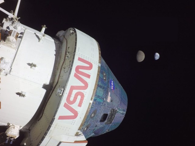 This photograph shows Orion in the foreground on flight day 13 of the Artemis 1 mission, Nov. 28, 2022. Earth and the Moon can be seen in the background. On that day, Orion reached its maximum distance from Earth during the Artemis I mission when it was 268,563 miles away from our home planet. Orion has now traveled farther than any other spacecraft built for humans.