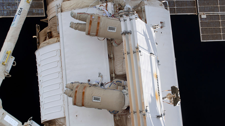 Cosmonauts Sergey Prokopyev and Dmitri Petelin install a radiator on the Nauka science module during a spacewalk on April 19, 2023.