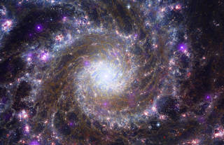 Composite image of Messier 74, a spiral galaxy similar to the Milky Way.