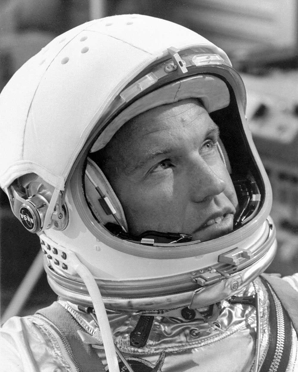 Gordon Cooper wearing a white helmet