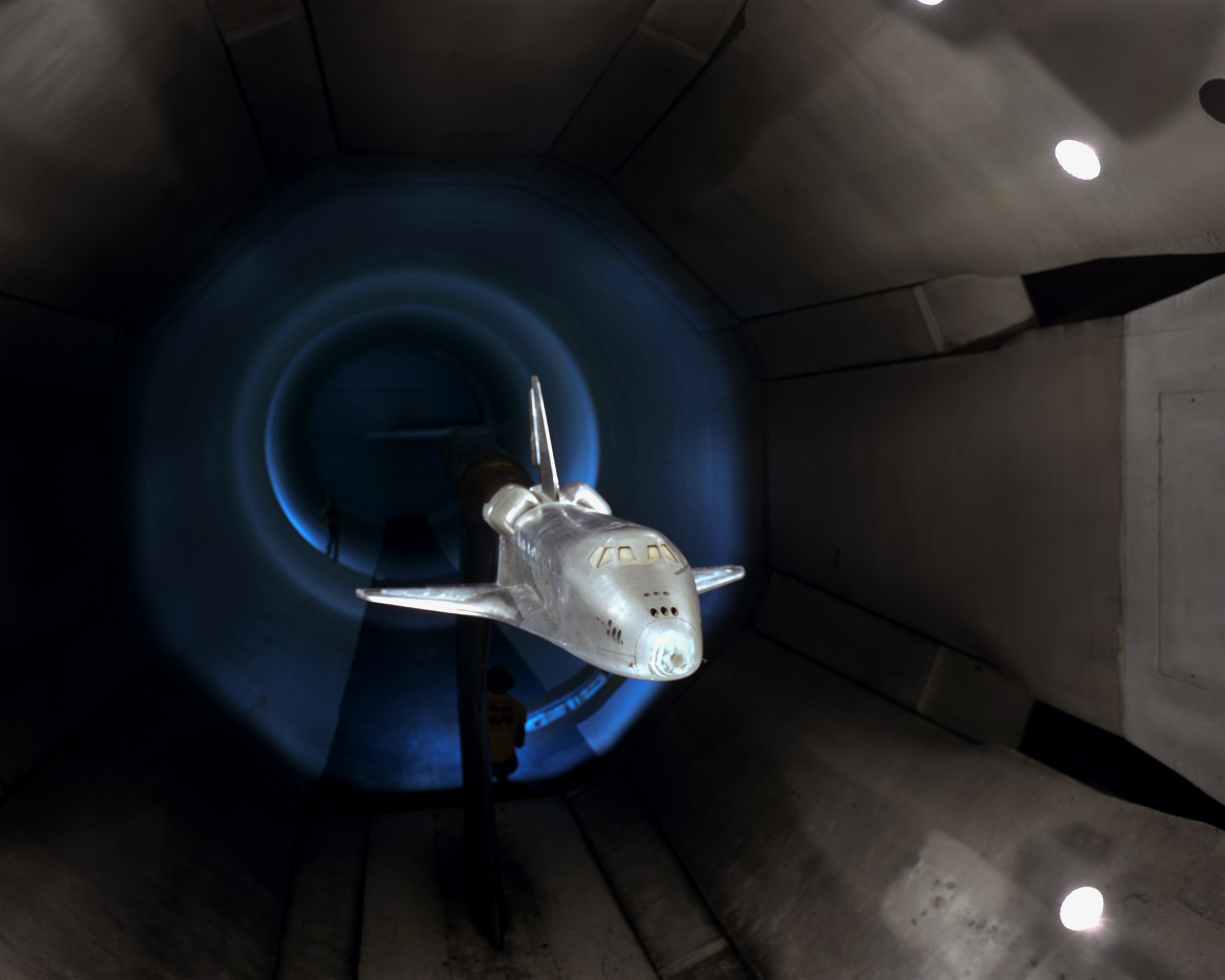 A NASA model of a space shuttle installed in Langley's 16 foot Transonic Tunnel.