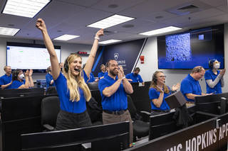 Members of the DART team celebrate on Sept. 26, 2022, as images live-streamed from the spacecraft show it successfully impacted the asteroid Dimorphos, completing the world's first planetary defense test mission.