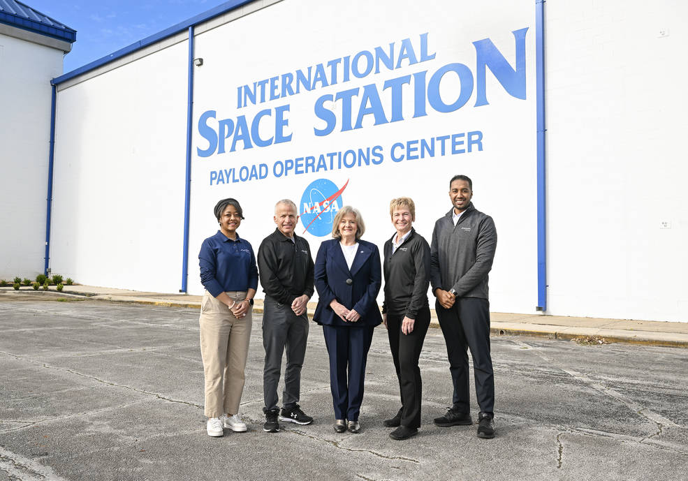 Jody Singer, center, director of NASA’s Marshall Space Flight Center, is pictured at the Payload Operations Center with the Axiom-2 crew from Axiom Space targeted for launch on May 21. 