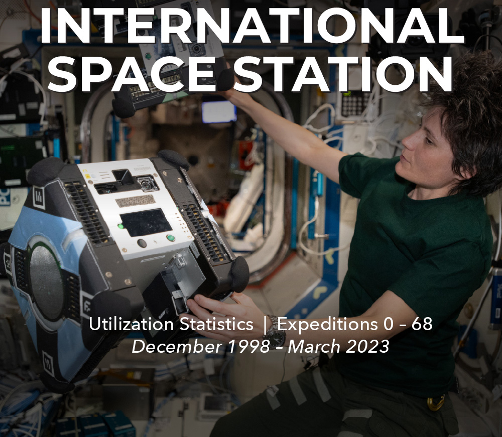 ESA astronaut Samantha Cristoforetti works with floating autonomous robots inside the space station.
