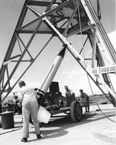 technicians_hoist_wac_corporal_into_launch_tower_wsmr_museum