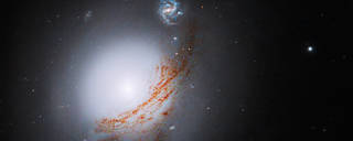 The lenticular galaxy NGC 5283 is the subject of this NASA Hubble Space Telescope image. NGC 5283 contains an active galactic nucleus, or AGN. An AGN is an extremely bright region at the heart of a galaxy where a supermassive black hole exists. 