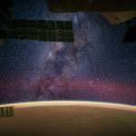 One of the Expedition 41 crew members aboard the International Space Station, flying at an altitude of 222 nautical miles above a point in the Atlantic Ocean several hundred miles off the coast of Africa near the Tropic of Cancer, photographed this eye-catching panorama of the night sky and the Milky Way on Sept. 27. NASA astronaut Reid Wiseman, flight engineer, tweeted the image, which was taken with an electronic still camera, set with a 24mm focal length. In his accompanying comments, Wiseman stated, "Sahara sands make the Earth glow orange."