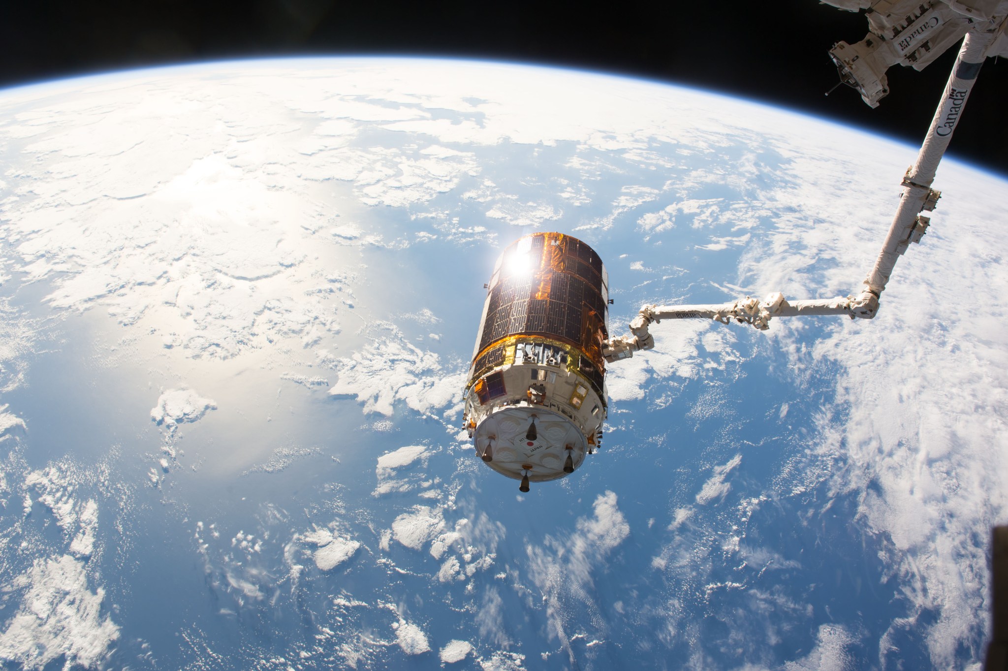 The Japanese HTV-6 cargo craft is pictured in the grips of the Canadarm2 after it was detached from the Harmony module of the International Space Station. Astronauts Thomas Pesquet of ESA (European Space Agency) and Commander Shane Kimbrough of NASA were at the controls of the robotic arm before commanding it to release the resupply ship.