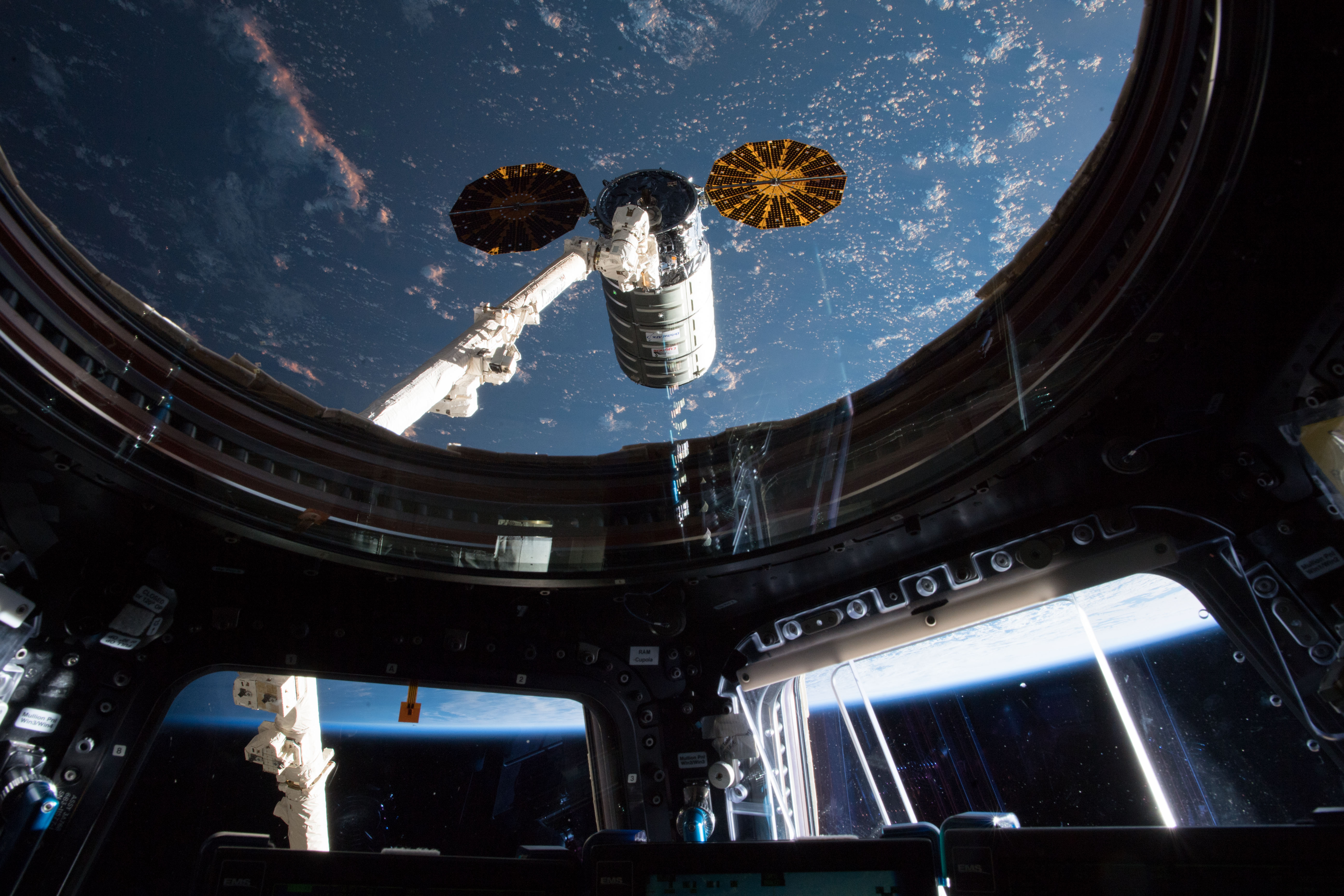 This view taken from inside the cupola shows the Orbital ATK space freighter moments before it was grappled with the Canadarm2 robotic arm.