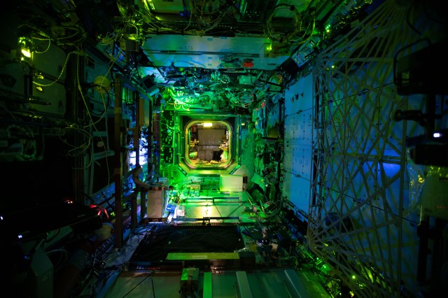 View of the interior of the U.S. lab taken with green night lighting.